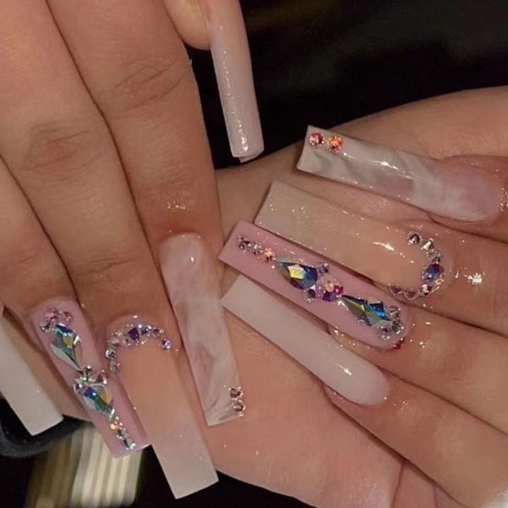 Glamorous artificial nails with gemstone embellishments Kalsten