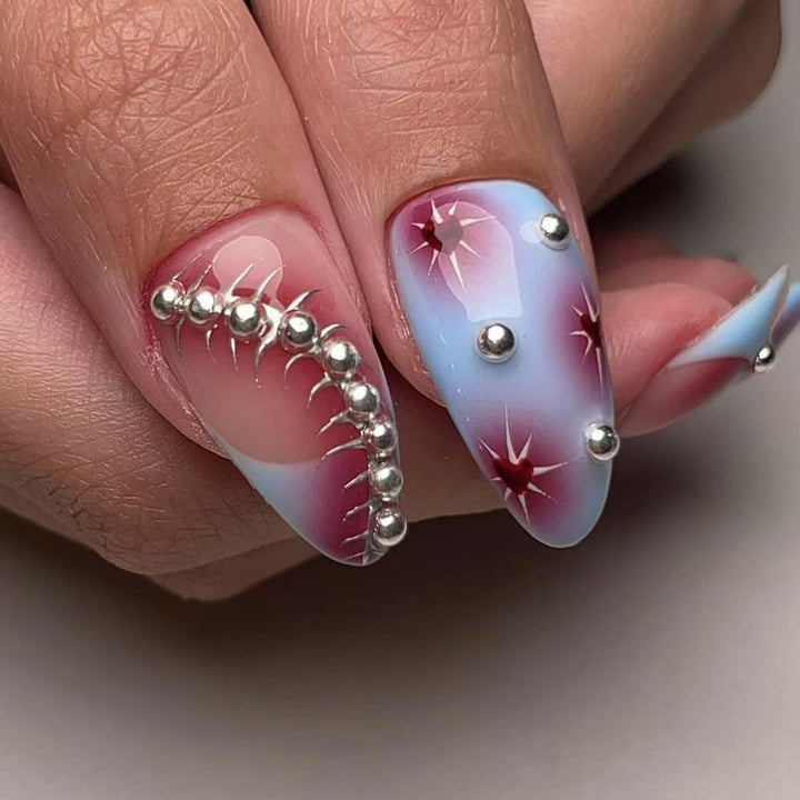 Creative nail art set with artistic color gradients and glitter embellishments Kalsten