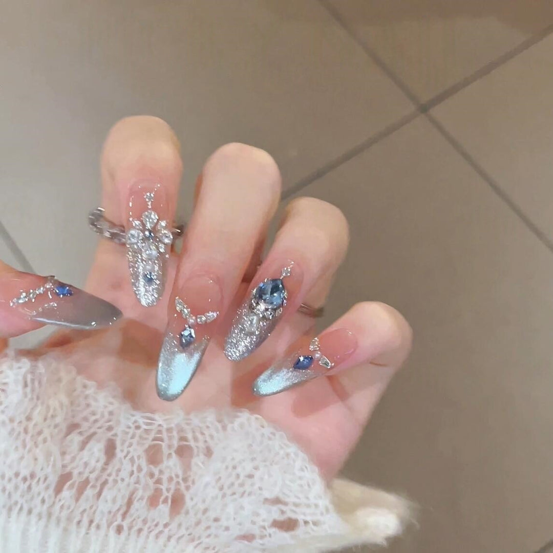 Glamorous artificial nails with sparkling rhinestone accents Kalsten