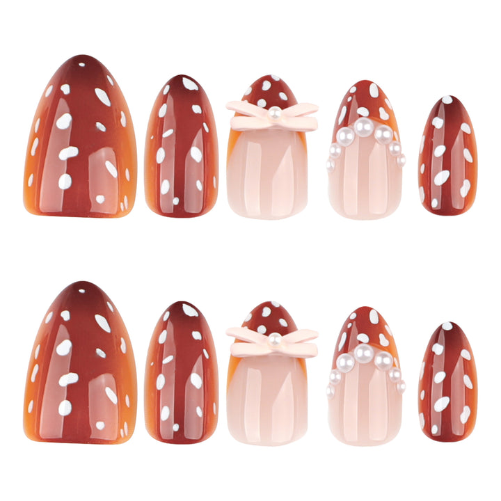 Artificial nail art with dot pattern and bow accents Kalsten