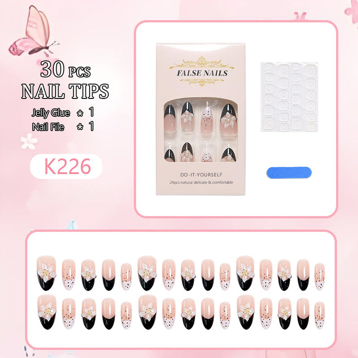 Artful nail tips with floral embellishments Kalsten