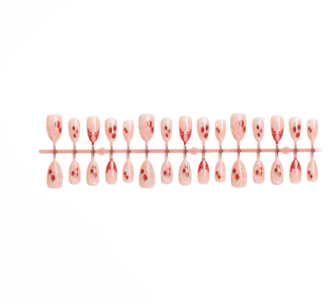 Artificial nail set with romantic strawberry and bow motifs Kalsten