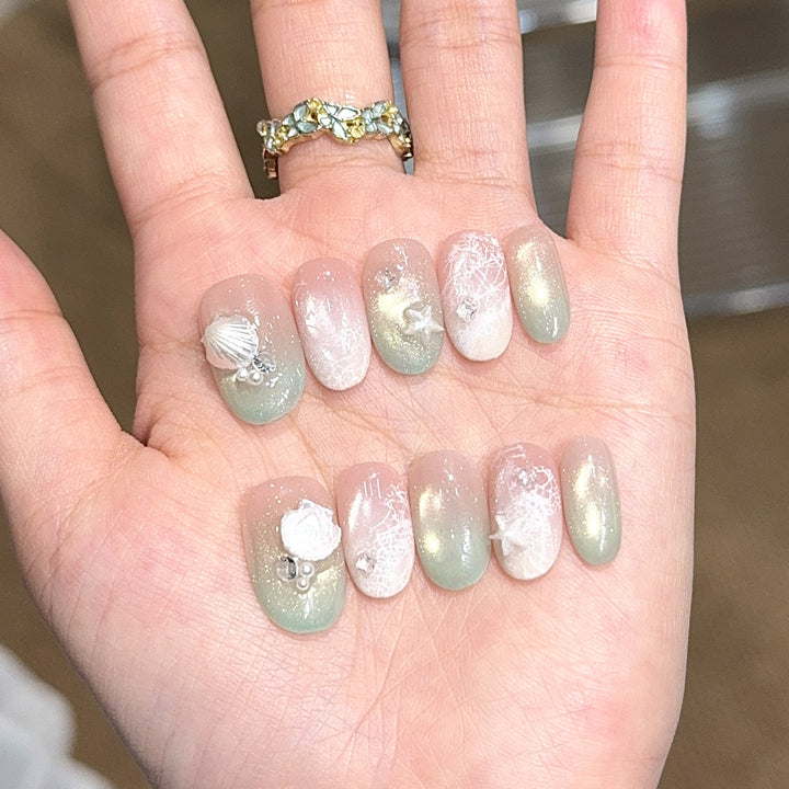 Artificial nail tips with maritime design and glitter effects Kalsten