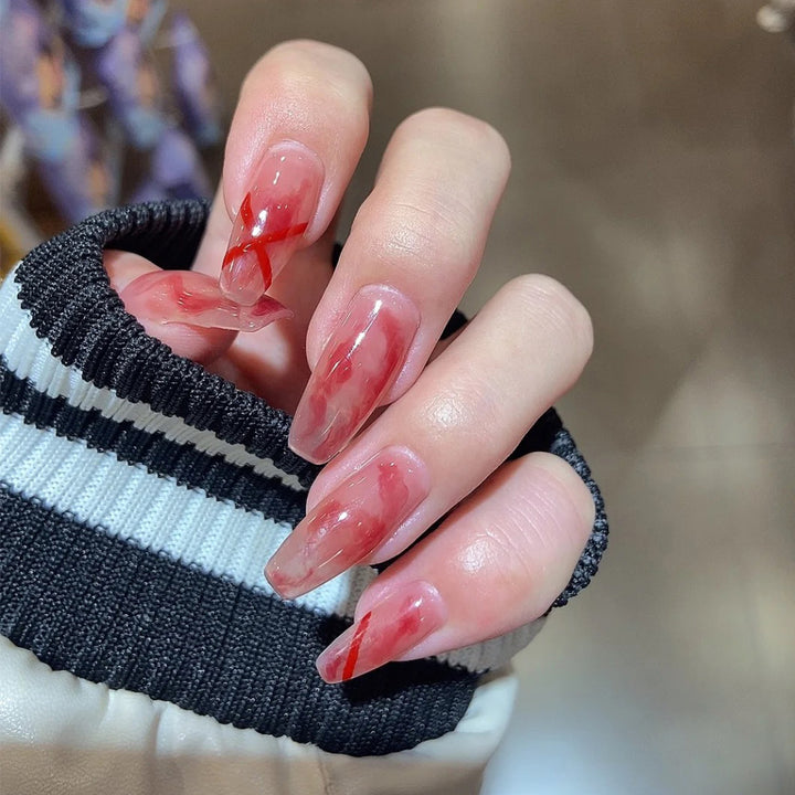 Artfully designed acrylic nails with marbled and decorative effects Kalsten
