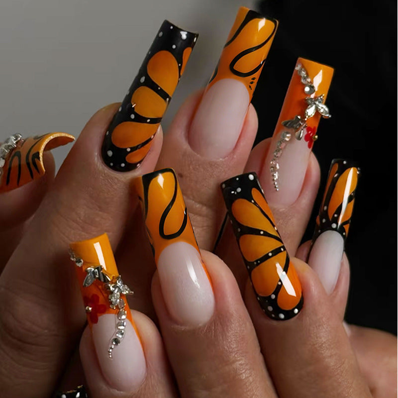 Creative nail set with shimmering floral and geometric designs Kalsten