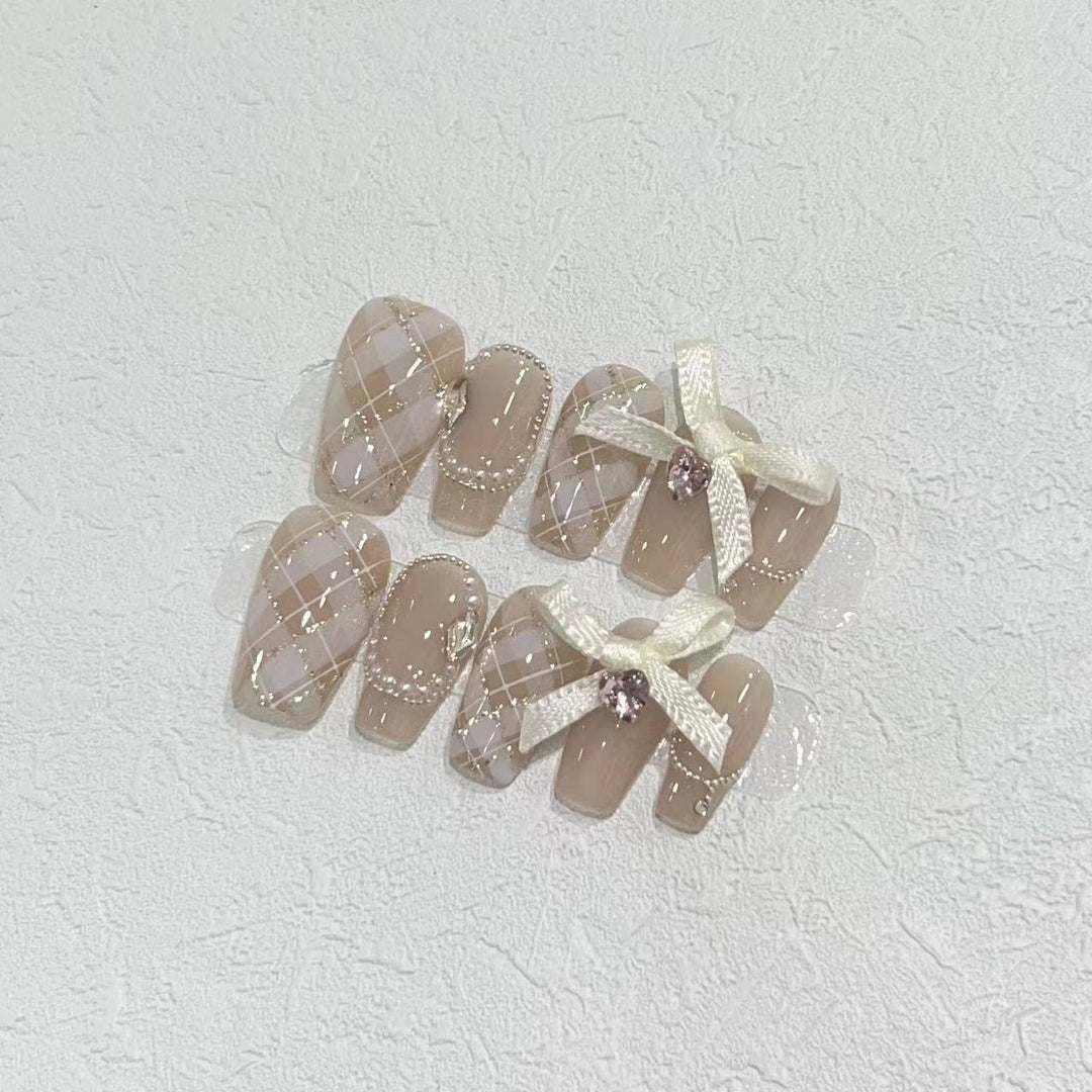 Elegant Press-On Nail Art Set with Ribbons and Gemstone Accents Kalsten