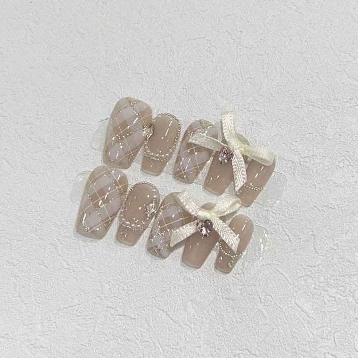 Elegant Press-On Nail Art Set with Ribbons and Gemstone Accents Kalsten