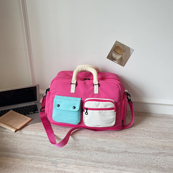 Sporty travel bag with multifunctional outer pockets Kalsten