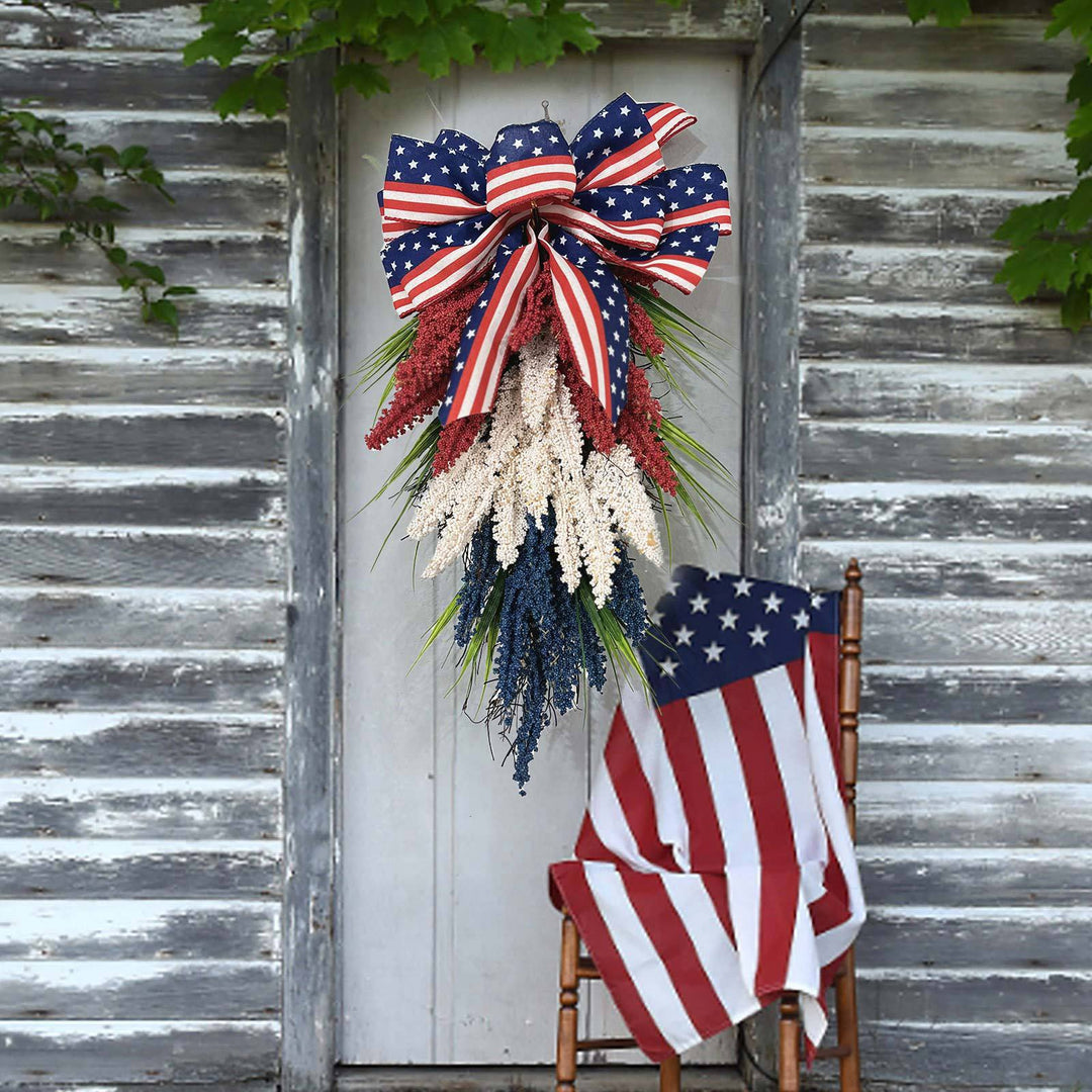 Unisex hanging floral swag with large bow and artificial berry branches Kalsten