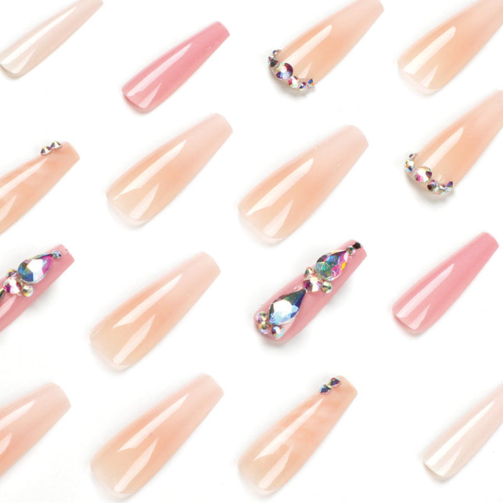 Glamorous artificial nails with gemstone embellishments Kalsten