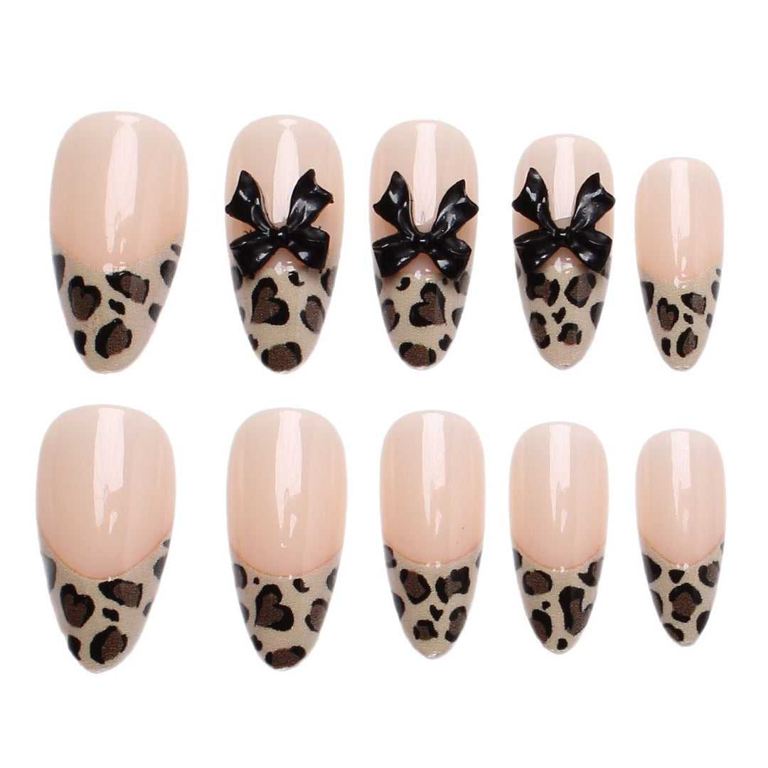 Creative artificial nails with stylish leopard pattern and bow accents Kalsten
