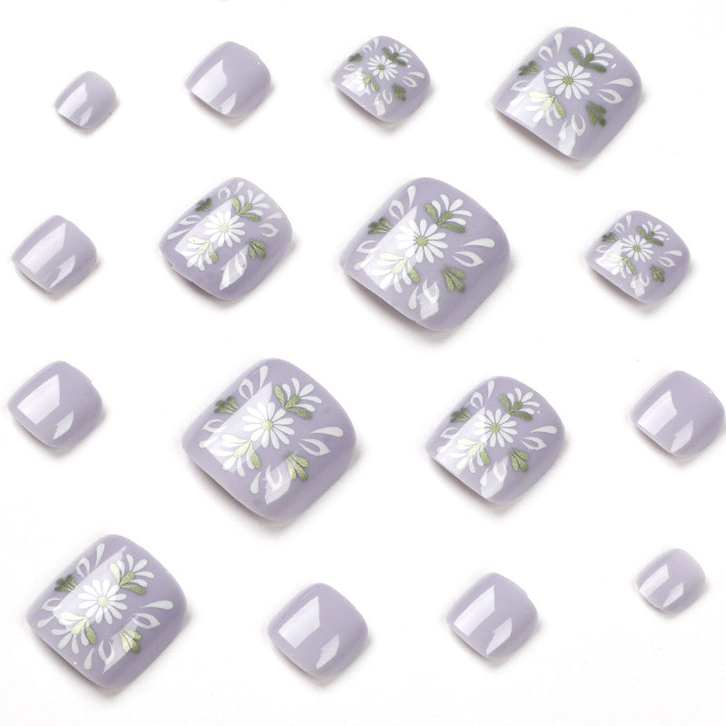 Artistic toenail design with elegant floral design Kalsten