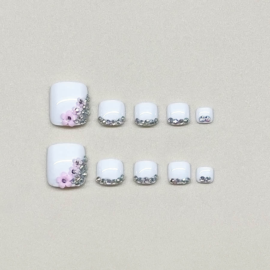 Nail art set with elegant glitter embellishments and floral accents Kalsten