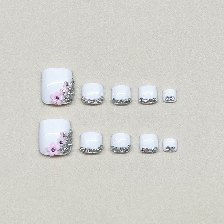 Nail art set with elegant glitter embellishments and floral accents Kalsten