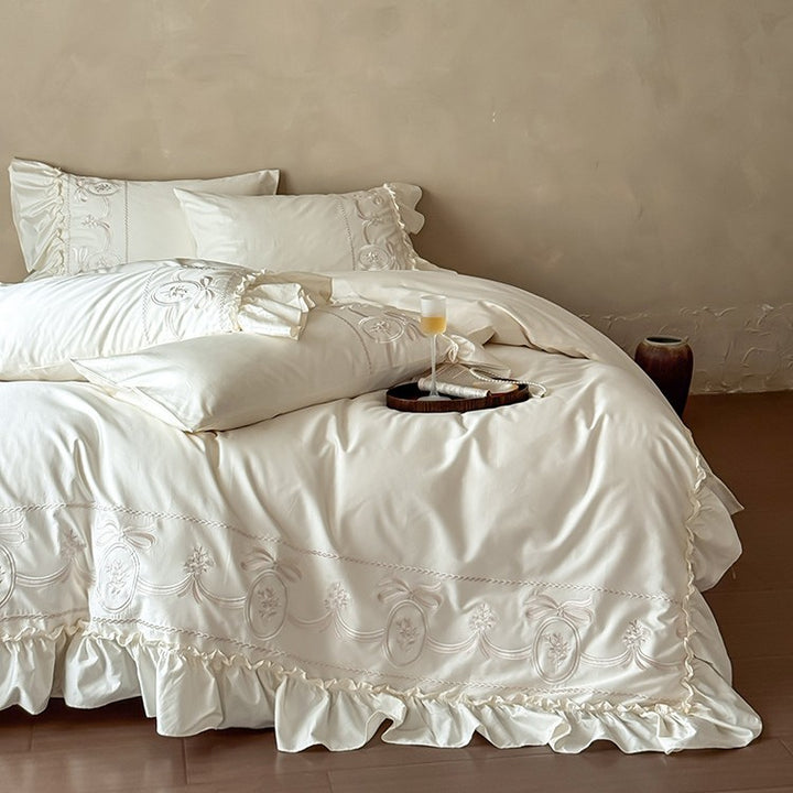 Luxurious satin bedding set with ornamental embroidery and gathered hem
