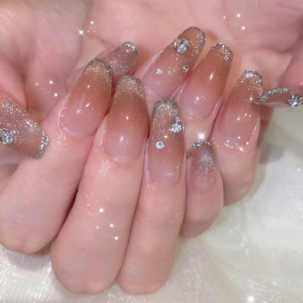 Glamorous artificial nails with glitter and rhinestone accents Kalsten