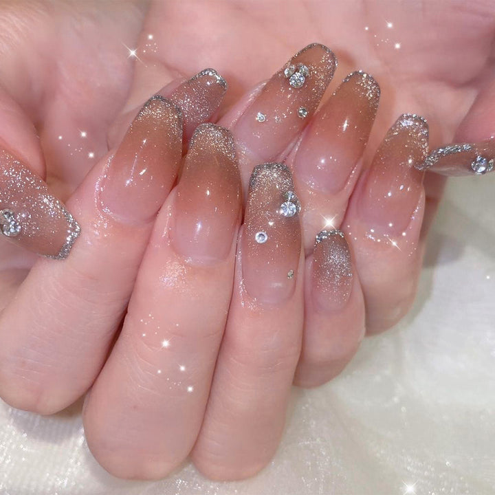 Glamorous artificial nails with glitter and rhinestone accents Kalsten