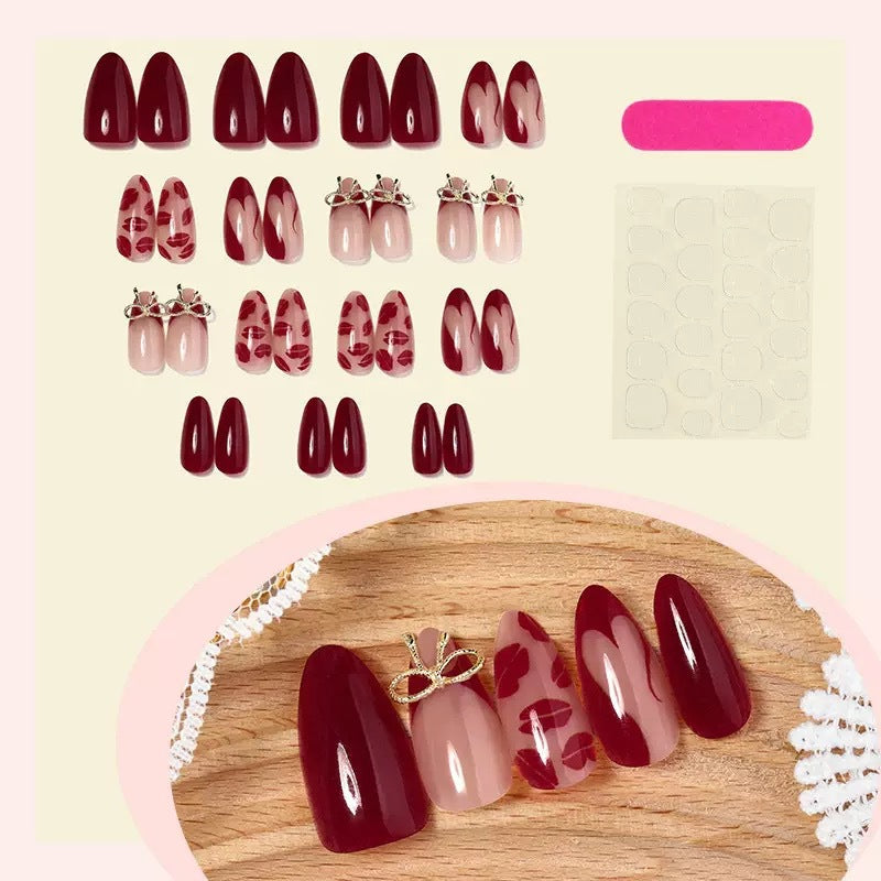 Acrylic nail set with elegant lip motifs and bow decorations Kalsten