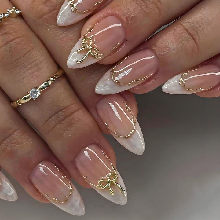 Acrylic nail set with elegant tips and delicate embellishments Kalsten