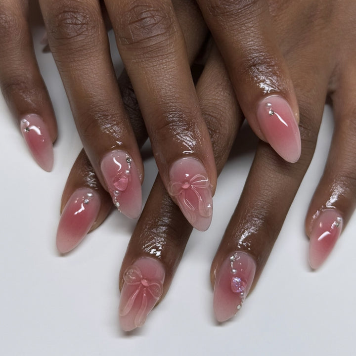 Artful nail extensions with delicate floral accents and glitter Kalsten
