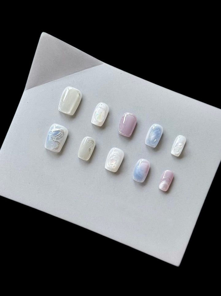 Artistic Press-On Nail Set with Ethereal Marble Effects