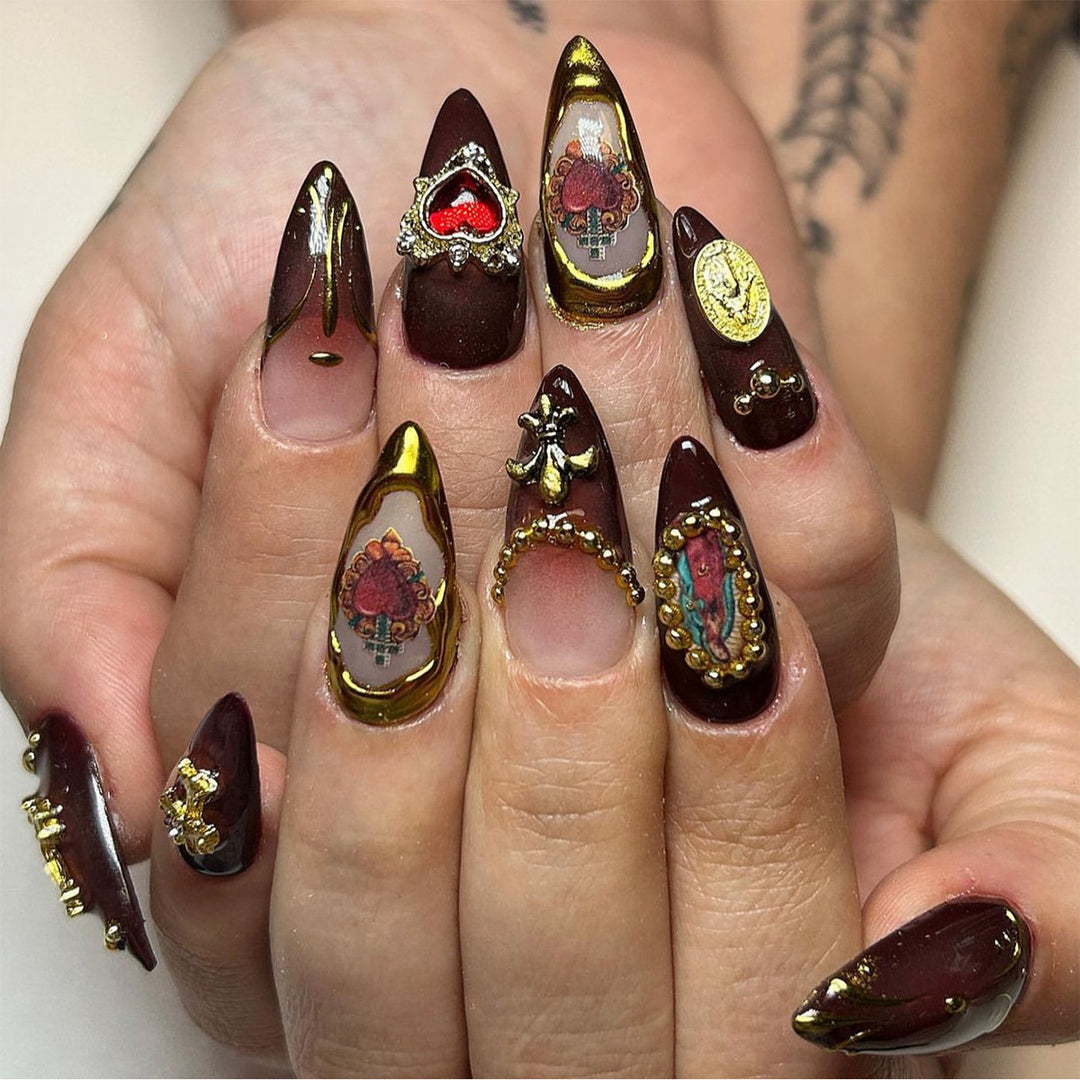 Artistic stiletto nails with detailed embellishments Kalsten