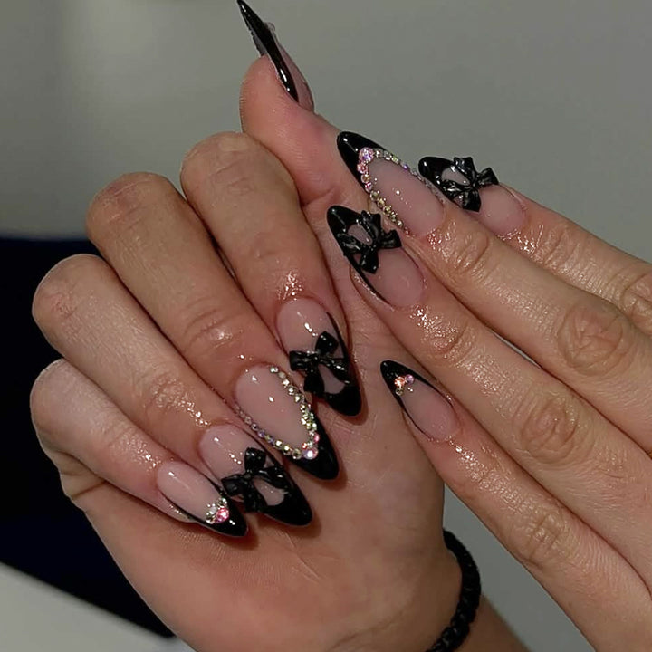 Elegant Stiletto Nail Design with Rhinestone Accents Kalsten