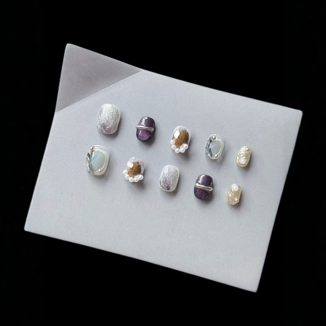 Artistic Press-On Nail Art Set with Unique Textures and Pearl Accents