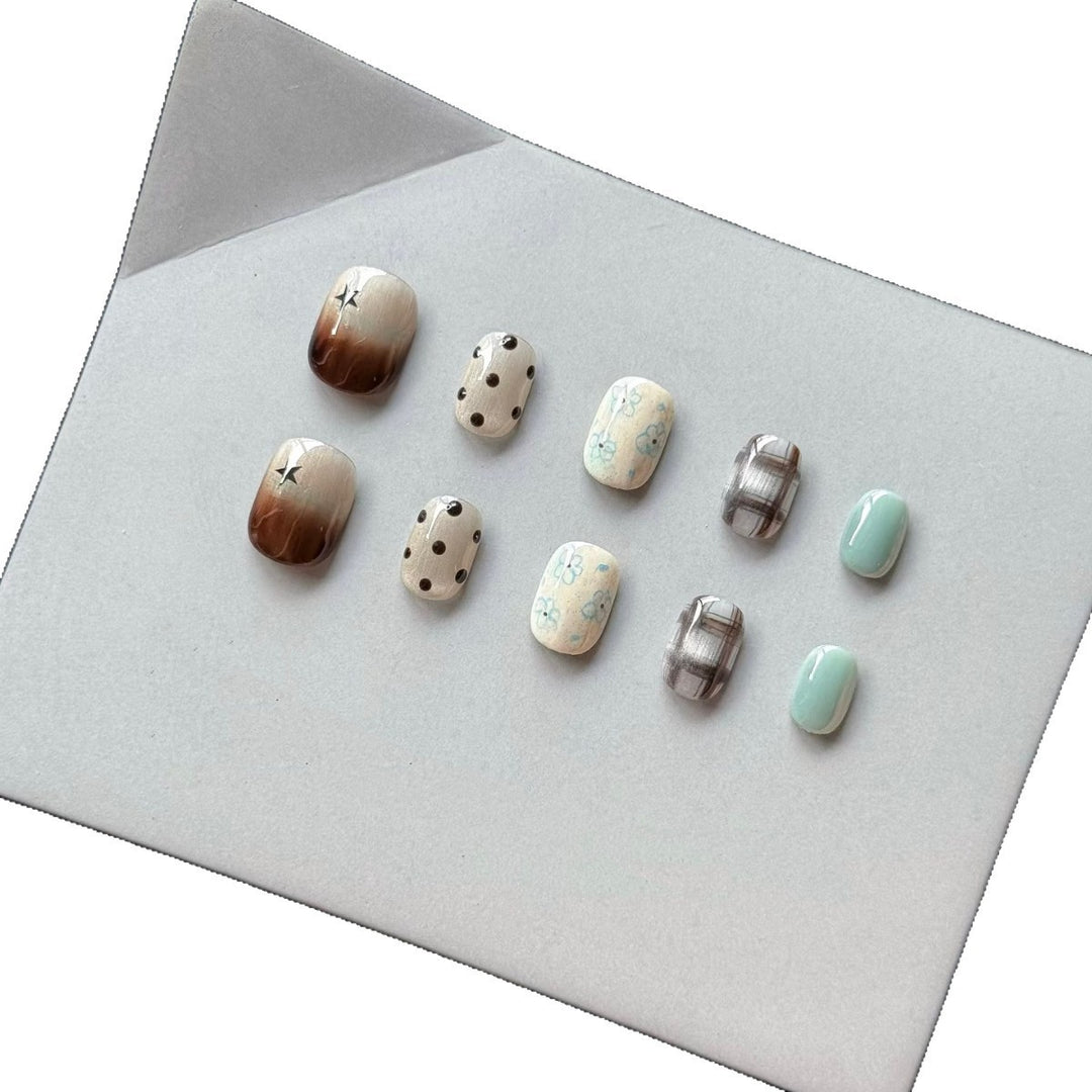Artistic Press-On Nail Art Set with Elegant Floral and Polka Dot Designs