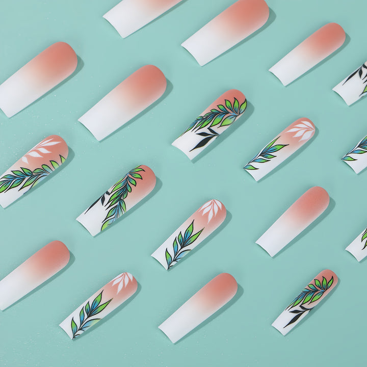 Artificial nails with elegant ombre design and floral accents Kalsten