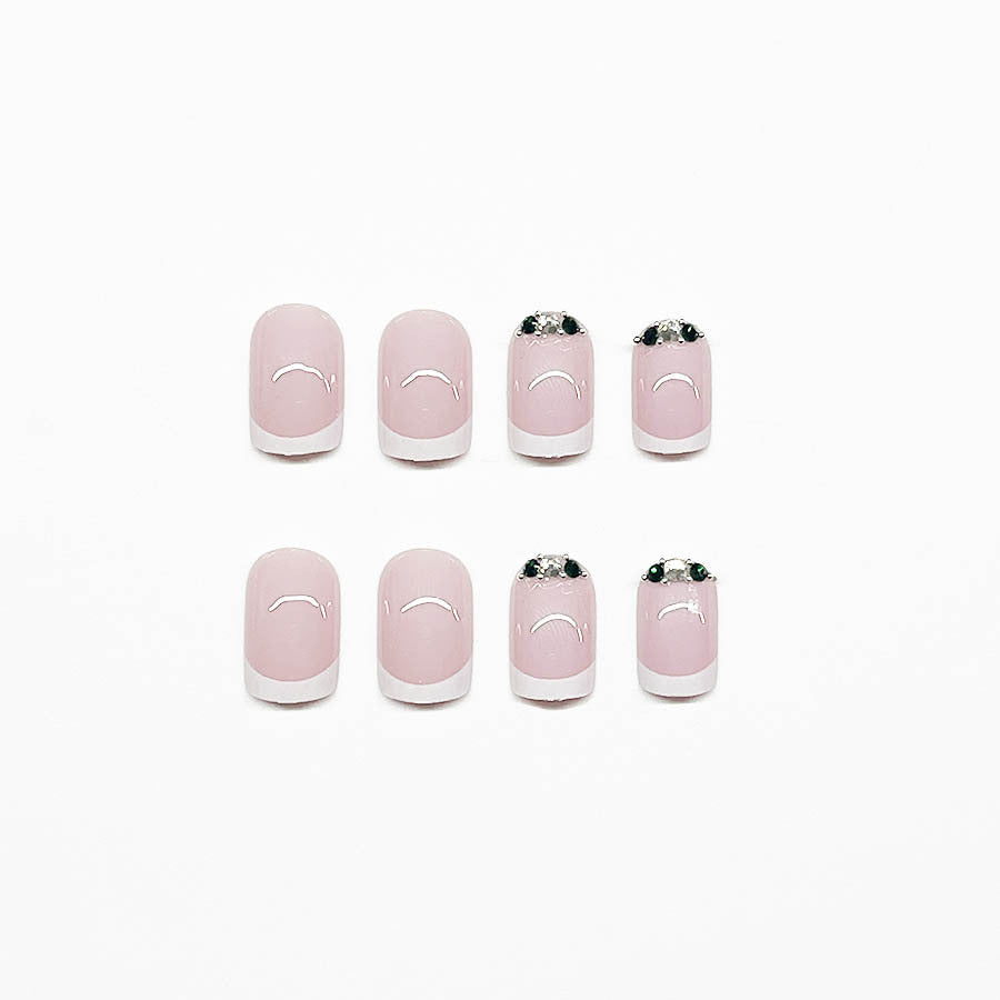 Art nail set with elegant French design and glittering accents Kalsten