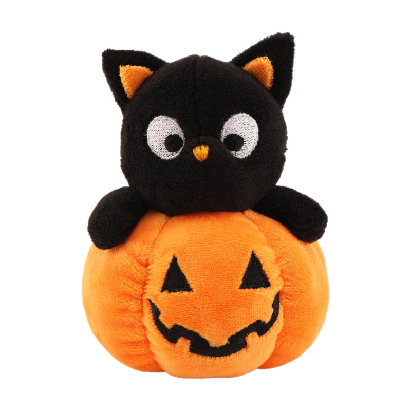 Plush figure cat on pumpkin with embroidered face