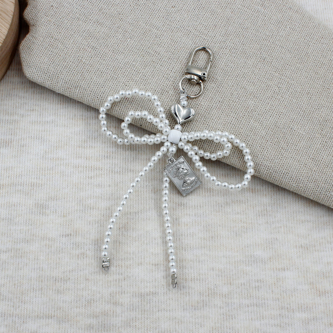 Elegant Beaded Bow Brooch Kalsten