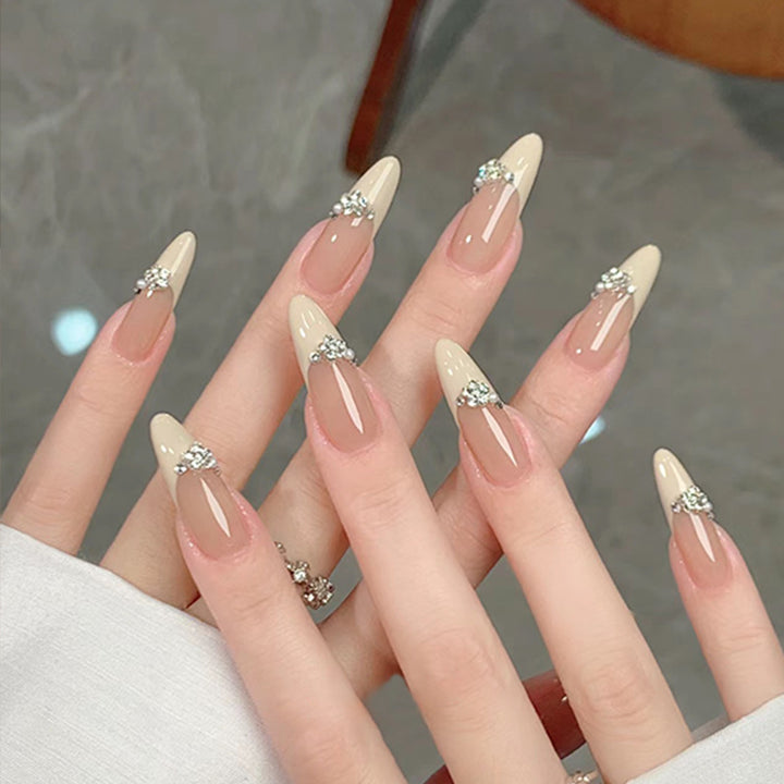 Acrylic nail set with elegant tips and sparkling appliqués Kalsten