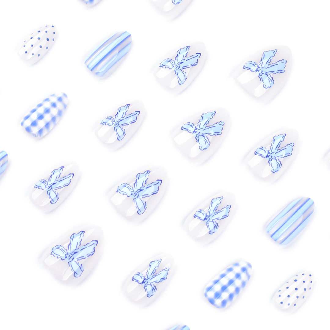 Artistic Nail Art with Floral and Polka Dot Designs Kalsten