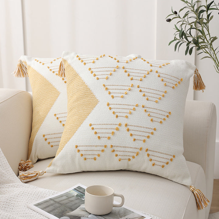 Decorative woven cushion cover with geometric tuft-relief and tassels Kalsten