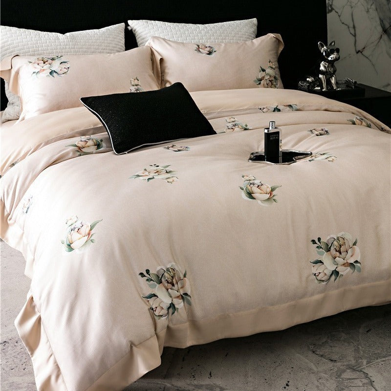 Duvet cover set made of cotton satin with subtle watercolor flower print and silky-matte texture