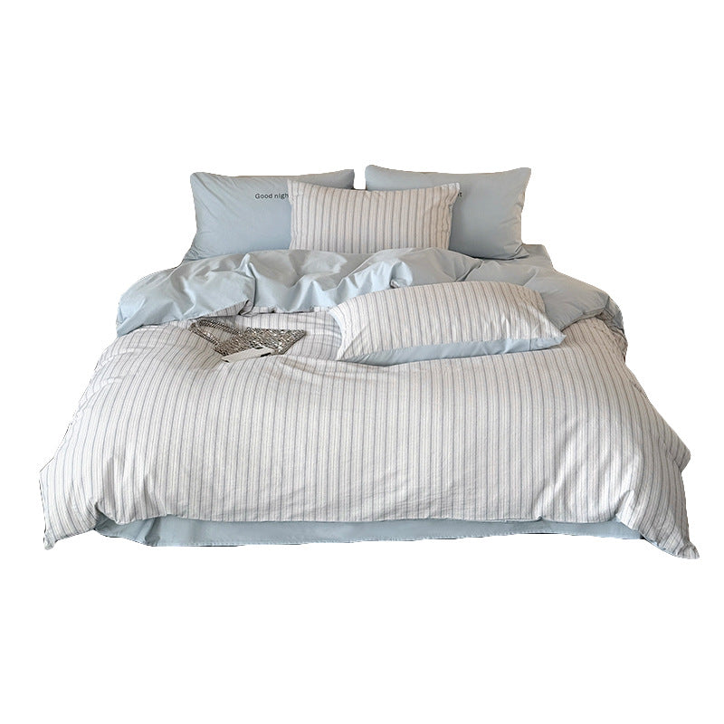 Modern bedding set made of breathable cotton muslin with a fine stripe pattern and reversible function