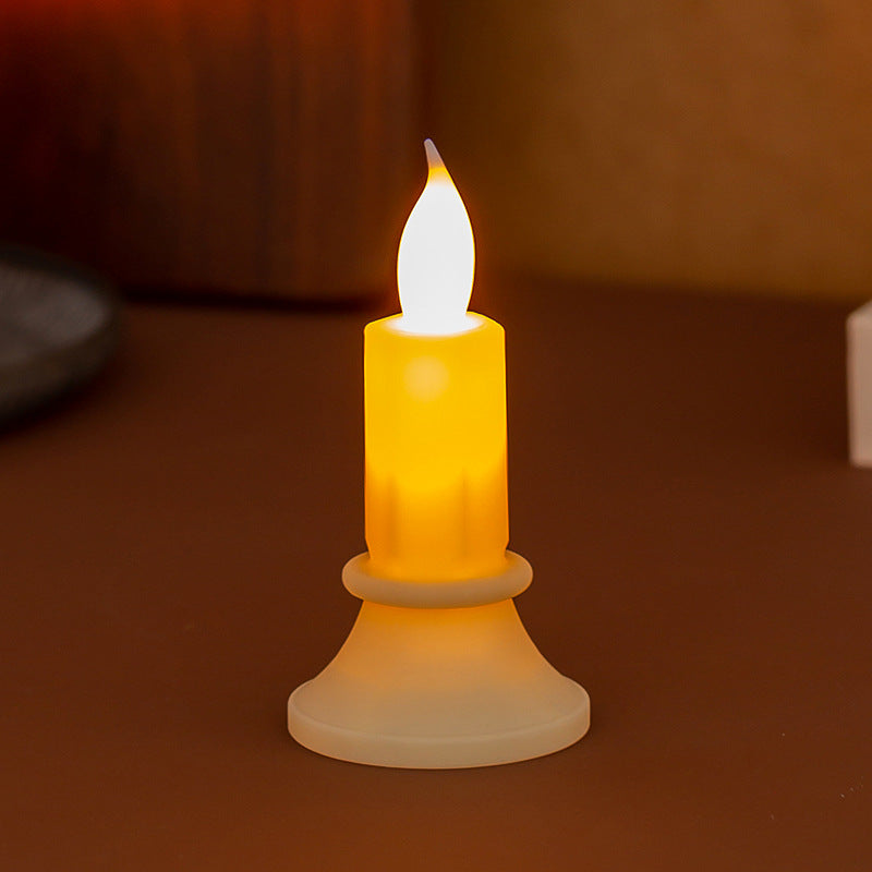 Flickering LED pillar candle in real wax look with removable holder