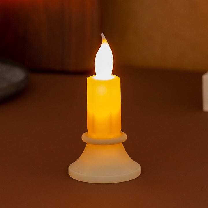 Flickering LED pillar candle in real wax look with removable holder