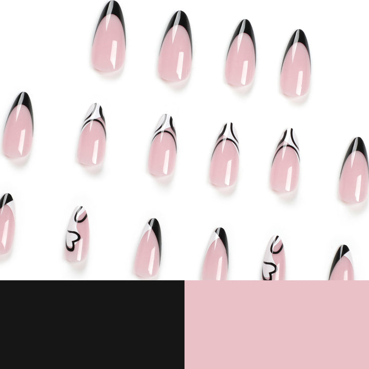 Artful stiletto nails with elegant black-and-white design Kalsten