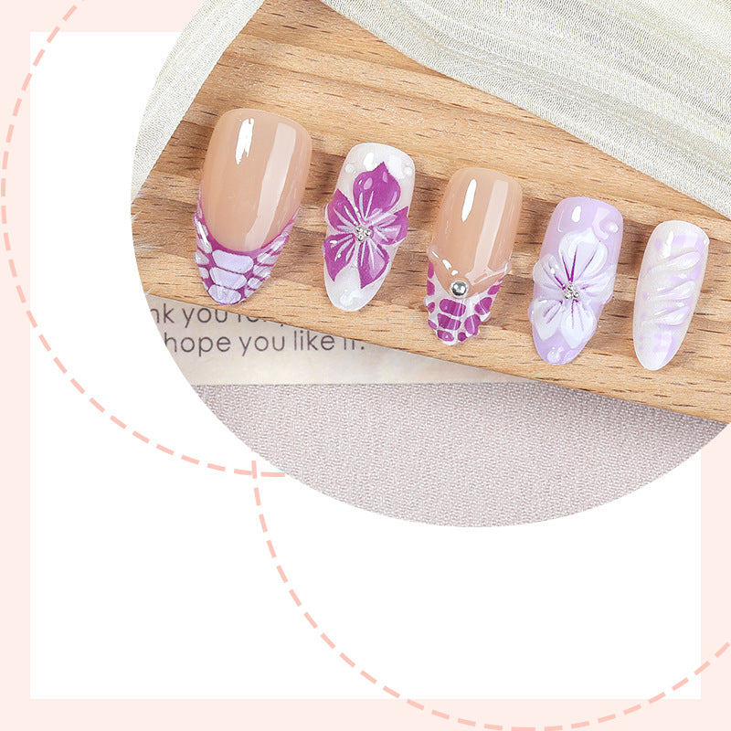 Artificial nail set with elegant flower designs and glitter accents Kalsten
