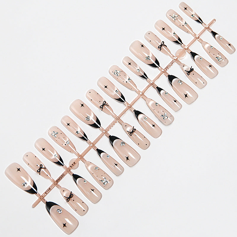 Nail art set with elegant black and white design and sparkling applications Kalsten