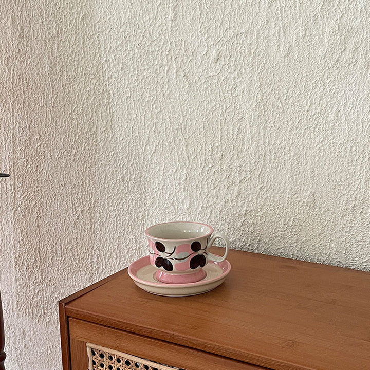 Ceramic coffee cup set with saucer and hand-painted leaf ornament