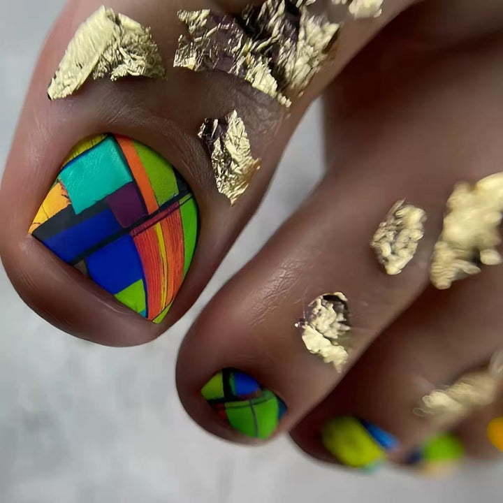 Creative toenail design with modern geometric patterns and golden accents Kalsten