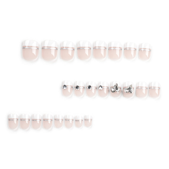 Elegant Nail Art with Glitter Accents and Jewelry Details Kalsten
