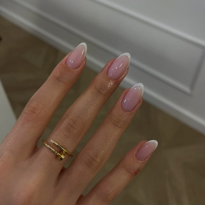 Artful nail extensions with elegant gradient and precise French tip Kalsten
