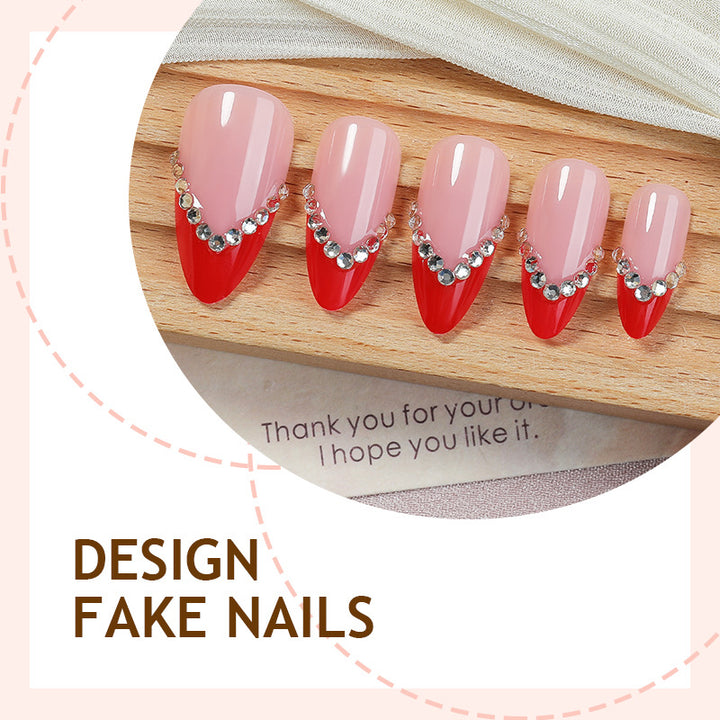 Nail art set with elegant red accents and rhinestone embellishments Kalsten