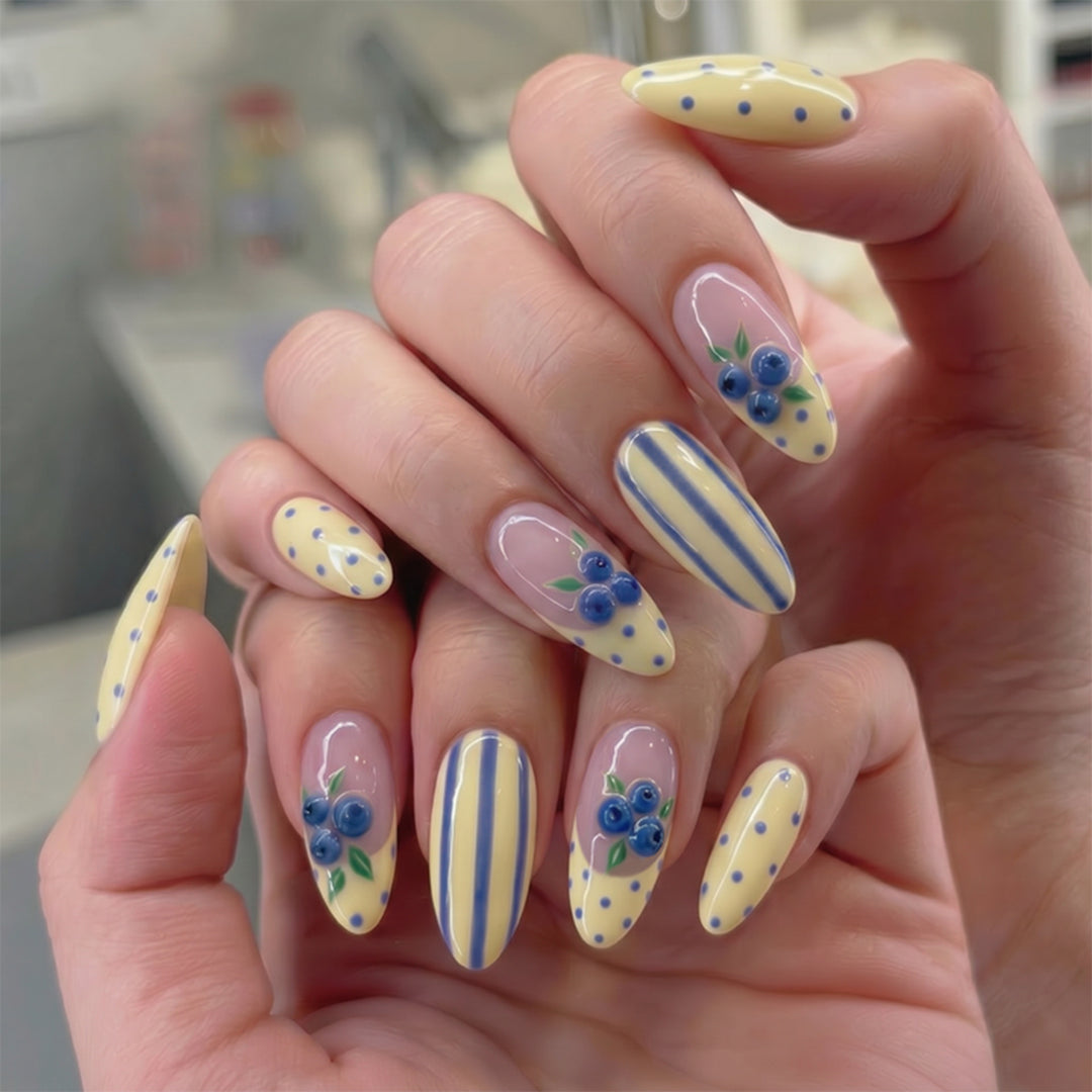 Artful stiletto nails with floral accents and colorful patterns Kalsten