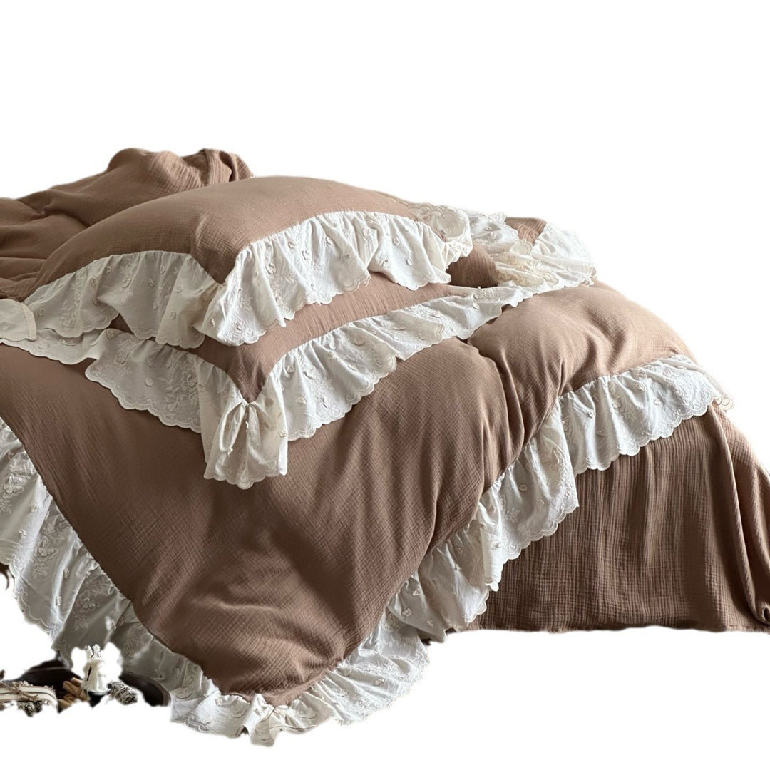 Quilted cotton duvet with embroidered frill and layered ruffled bed skirt